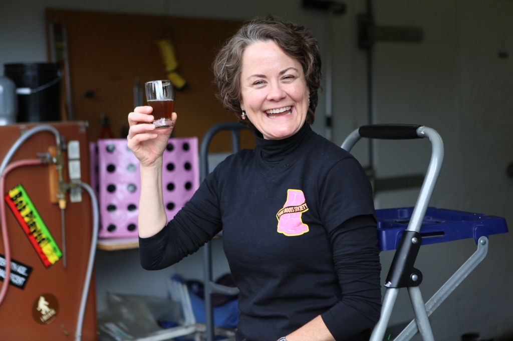 Teri raises a glass of beer in salute